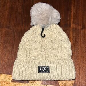 UGG women’s yellow Cable Knit Beanie with Pom-Pom